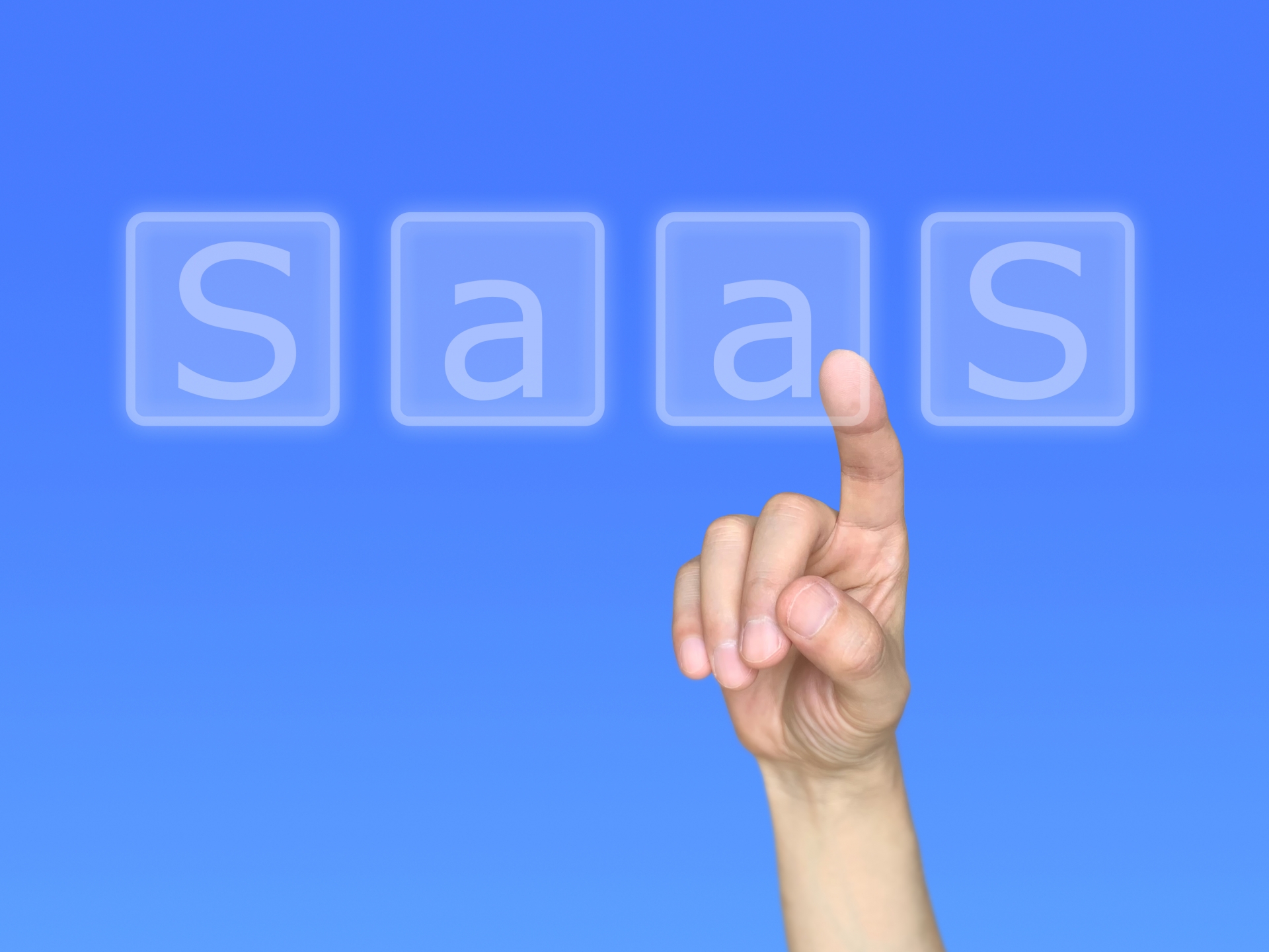 「SaaS」の文字をタッチする指